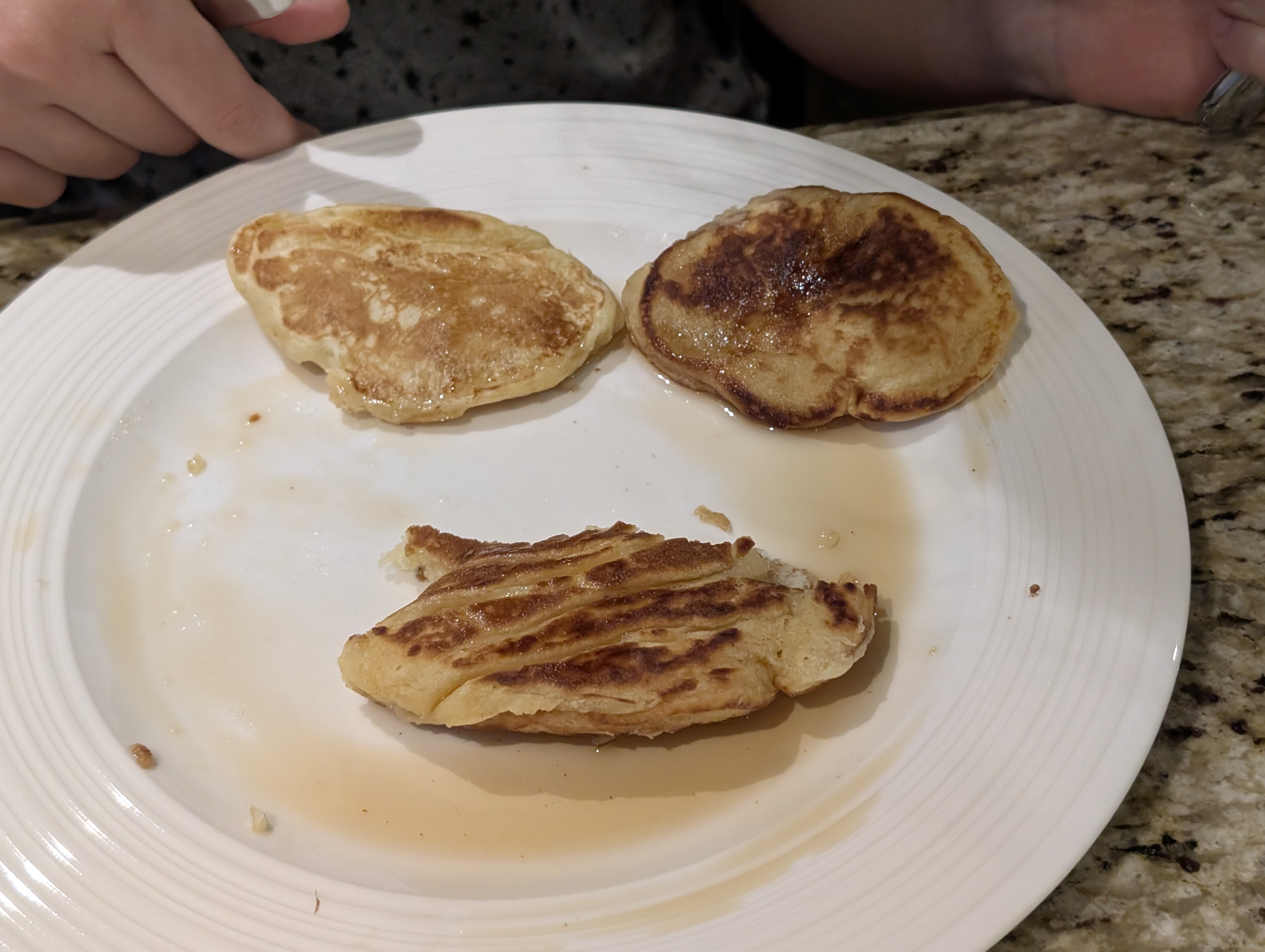 Pancakes on plate with syrup